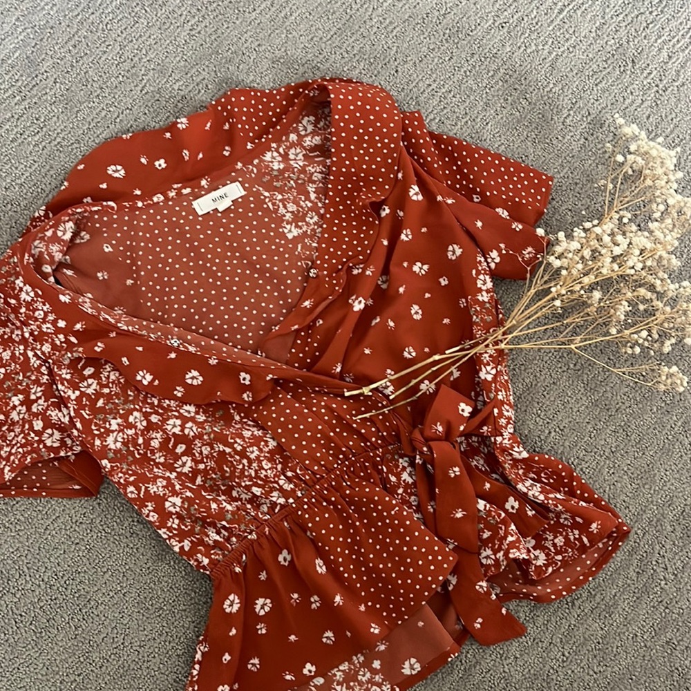 patterned orange blouse